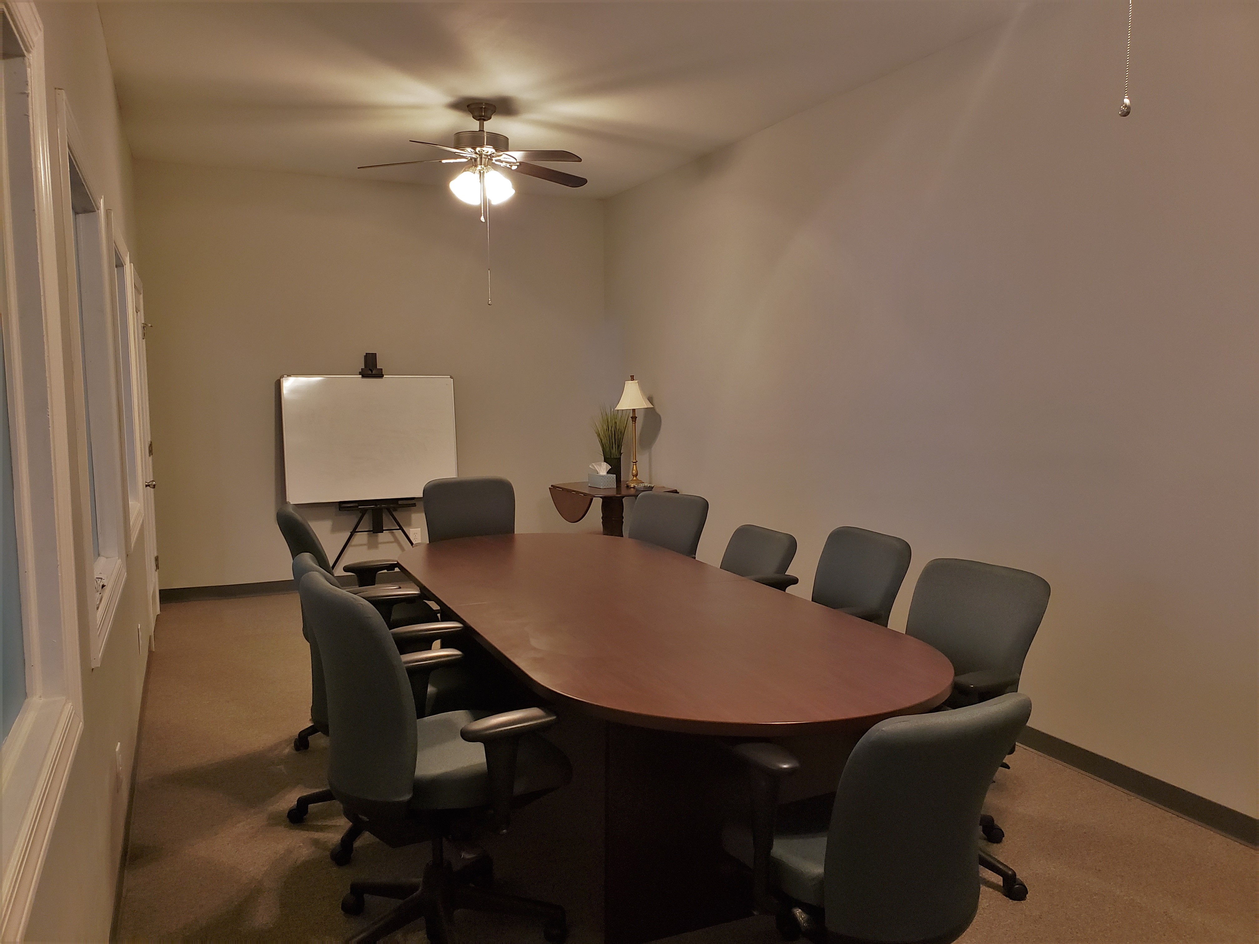 A black desk with a computer